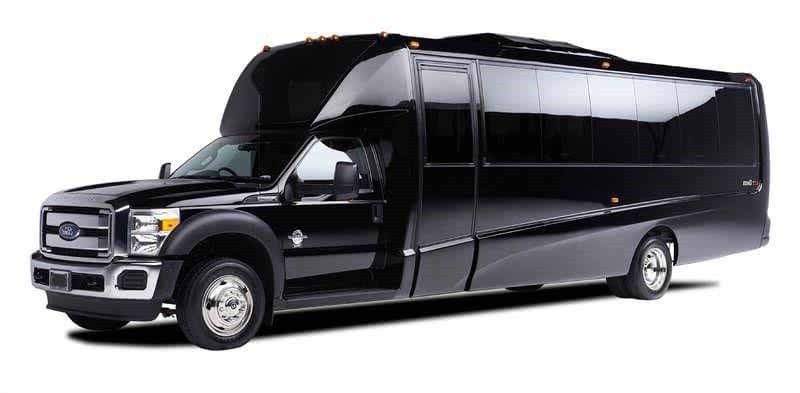 Black Ford F-550 luxury limousine bus on white background.