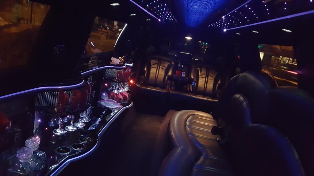 Luxury limousine interior with mood lighting at night