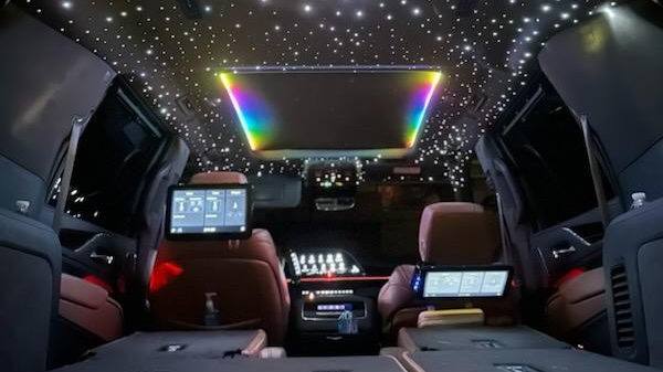 Luxurious car interior with starlight headliner and screens