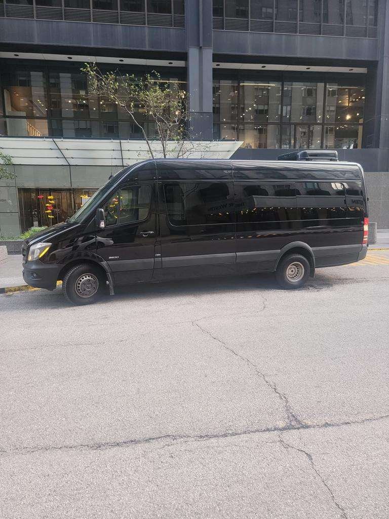 Mercedes Benz Sprinter Van - Black van parked on city street