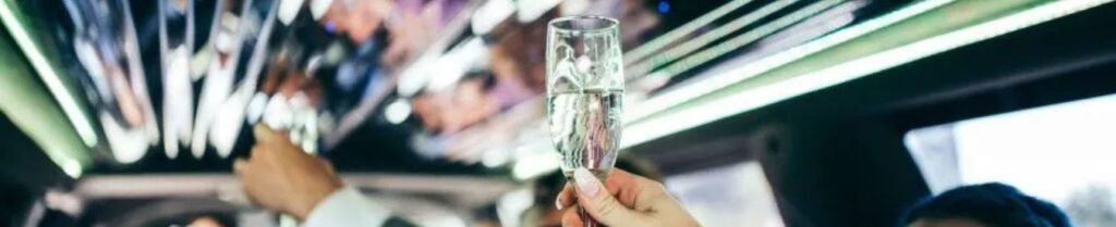 Can You Drink Alcohol in a Limo? - People toasting with champagne in a limo