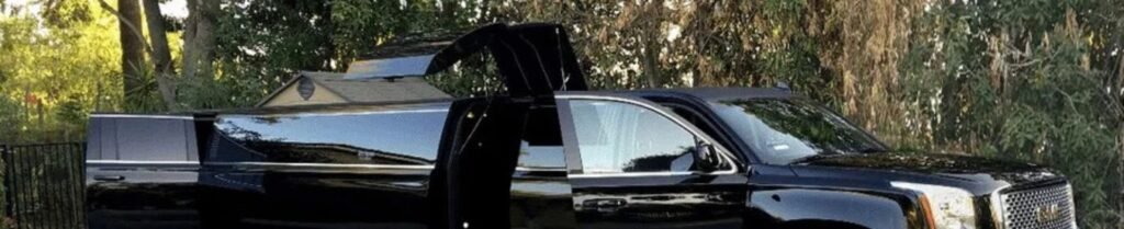 Do I Need to Sign a Contract When Renting a Limo? - Black luxury SUV with open doors in nature.