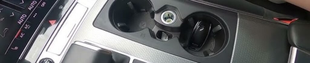 Do Limousines Have Phone Chargers or Power Outlets? - Car interior with cup holders and dashboard controls