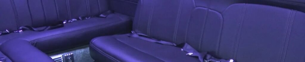 Do Limousines Have Seat Belts? - Luxury car interior with plush black seats