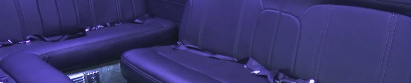 Do Limousines Have Seat Belts? - Luxury car interior with plush black seats