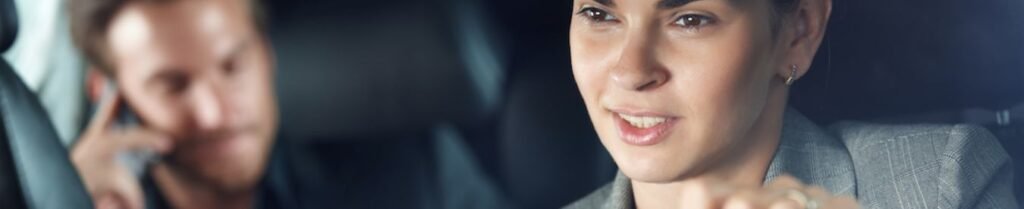 Tip a Chauffeur - Woman driving car, man talking on phone