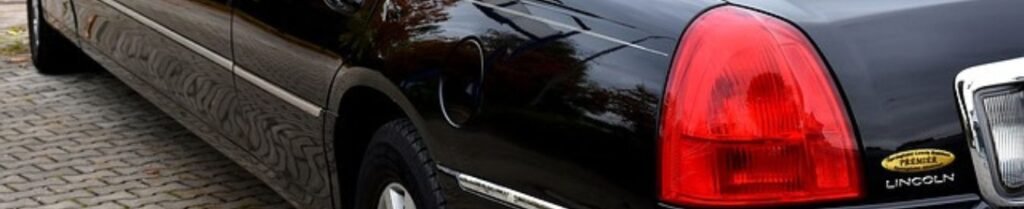 How Far in Advance Should I Book a Wedding Limo? - Black limousine parked on cobblestone street