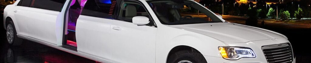 Limo Cost for a Wedding - White limousine with open door at night