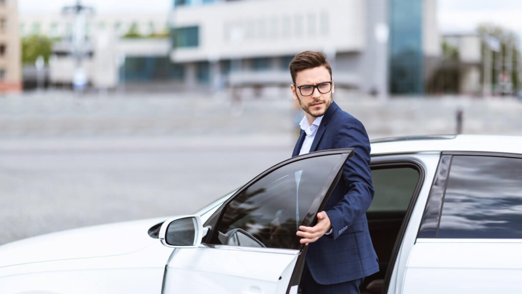 What is a Corporate Car Service - Man in suit exiting car