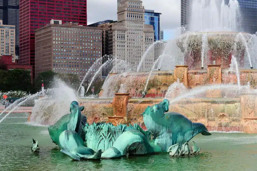 Buckingham Fountain spraying water in urban setting.